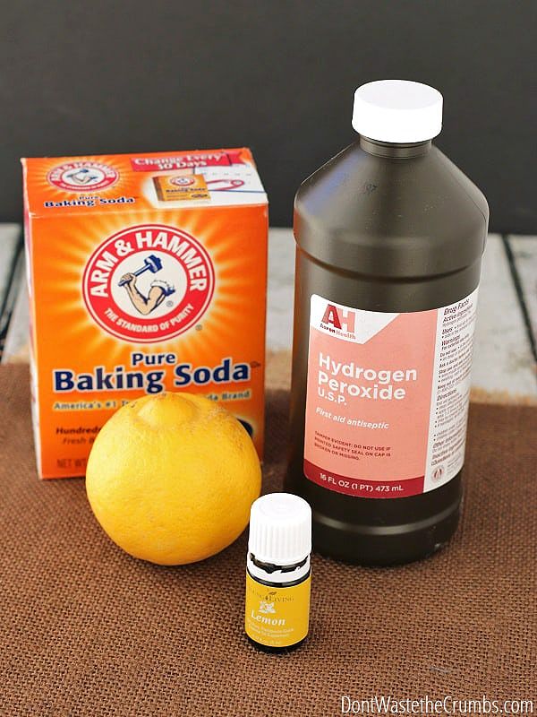 A whole lemon and baking soda as natural cleaning ingredients