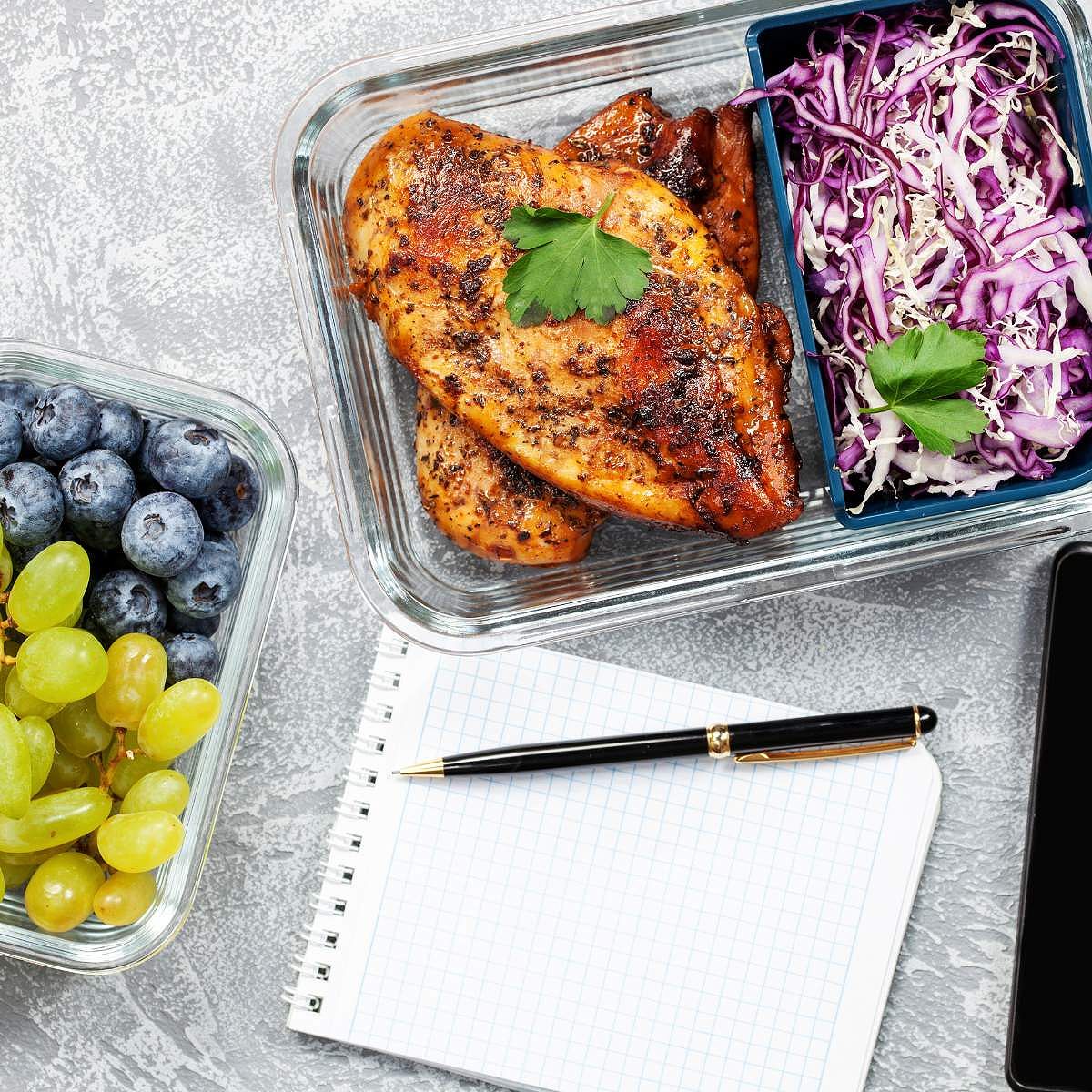 Pen and Pad Near Prepped Chicken, Shredded Cabbage and Fruit